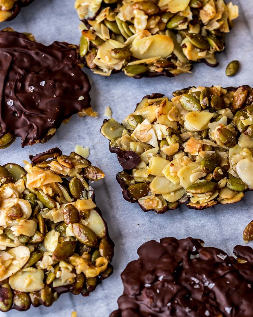 Crunchy Almond Seed Chocolate Cookies - Closeup on a parchment paper lined cooling rack